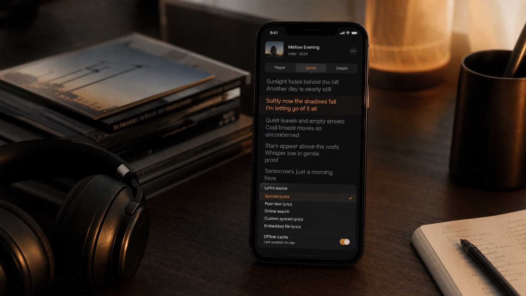 Natural desk photo of an iPhone music player showing synced lyrics and offline lyric sources